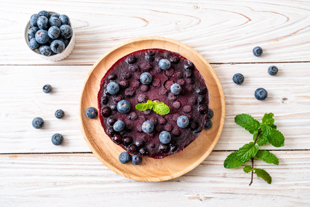 homemade blueberry cheese cake on wood backgroundの写真素材