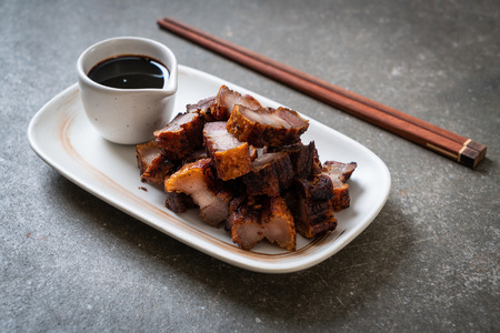 Fried Streaky Pork or Crispy Pork or Deep Fried Pork Belly with sauceの写真素材