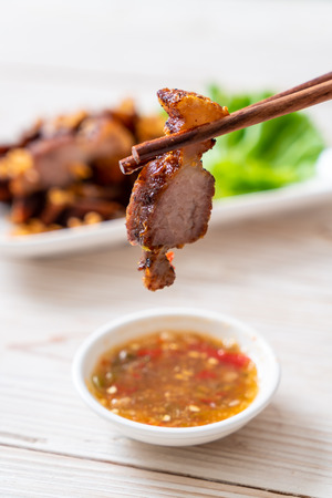 Fried Streaky Pork or Crispy Pork or Deep Fried Pork Belly with Sauceの写真素材