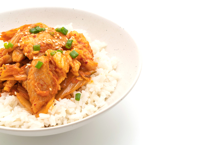 stir-fried pork with kimchi on topped rice isolated on white background - Korean food styleの写真素材