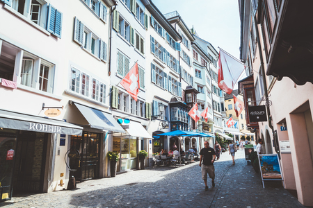 ZURICH, SWITZERLAND - AUG 23, 2018: Augustinergasse pedestrian Street with colorful buildings with cafe and restaurants in the old city center of Zurich City in Switzerlandのeditorial素材