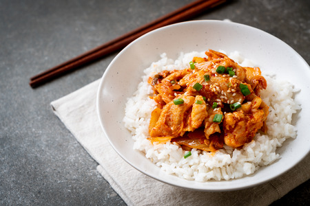 stir-fried pork with kimchi on topped rice - Korean food styleの写真素材