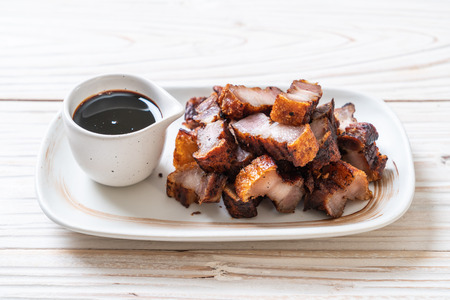 Fried Streaky Pork or Crispy Pork or Deep Fried Pork Belly with sauceの写真素材