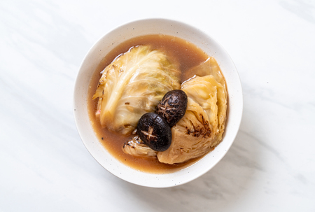 boiled cabbage in red soup with mushroom - vegan and vegetarian food in Asian styleの写真素材