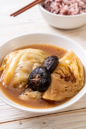boiled cabbage in red soup with mushroom - vegan and vegetarian food in Asian styleの写真素材