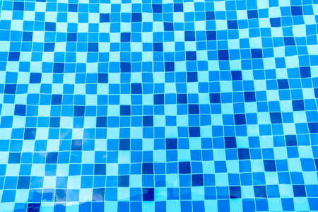 Swimming pool surface with floor mosaic tiles in blue