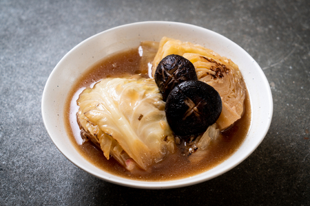 boiled cabbage in red soup with mushroom - vegan and vegetarian food in Asian styleの写真素材