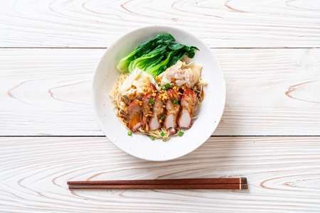 egg noodle with red roasted pork and wonton - Asian food styleの写真素材