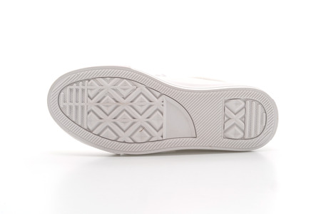 white sneakers isolated on white backgroundの写真素材