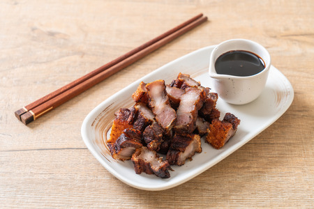 Fried Streaky Pork or Crispy Pork or Deep Fried Pork Belly with sauceの写真素材