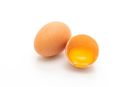 Cracked egg and shell isolated on white background