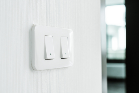 White light switch on wallの写真素材