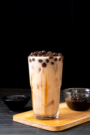 Taiwan milk tea with bubble on wood backgroundの写真素材