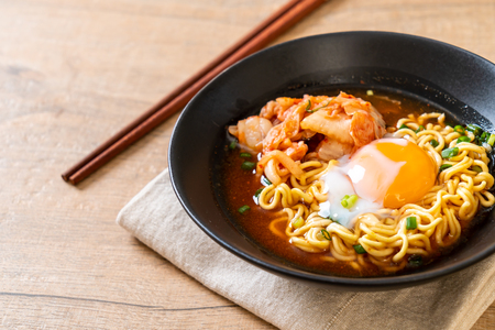 Korean instant noodles with kimchi and egg - Korean ramen styleの写真素材