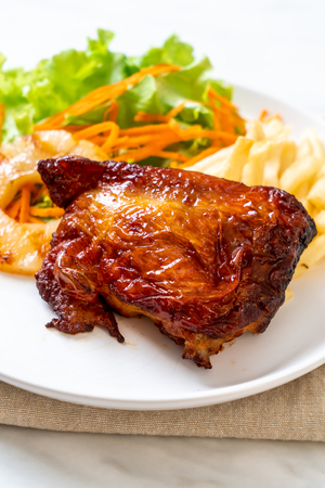 grilled chicken steak with vegetable and french friesの写真素材