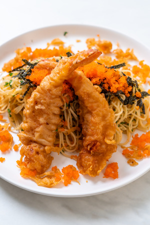 spaghetti with tempura shrimps and shrimp egg - fusion foodの写真素材