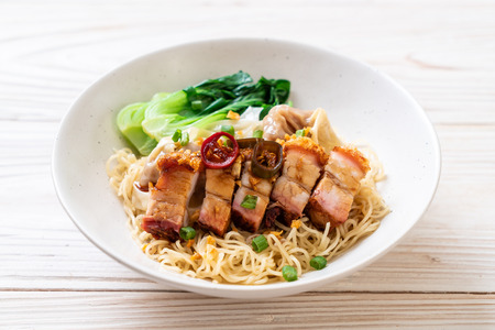 egg noodle soup with crispy pork belly and wonton - Asian food styleの写真素材