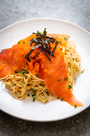 spaghetti with smoked salmon and shrimp egg - fusion food styleの写真素材