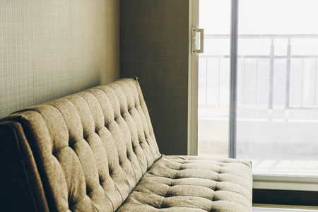 Modern fabric sofa in room interiorの写真素材