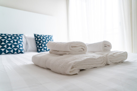 white towel decoration on bed in bed room interior