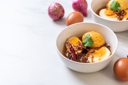 Fried Boiled Egg with Tamarind Sauce or Sweet and Sour Eggsの写真素材