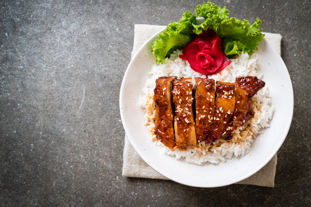 grilled chicken with teriyaki sauce on topped rice bowl