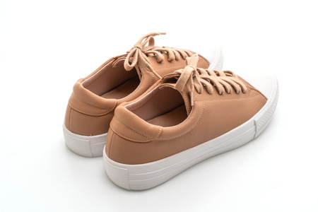 brown sneakers isolated on white backgroundの写真素材