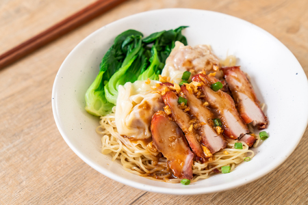 egg noodle with red roasted pork and wonton - Asian food styleの写真素材