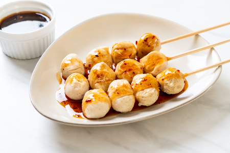 grilled pork meatballs with sweet chili sauce on plateの写真素材