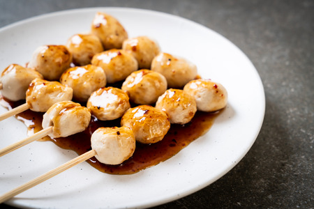 grilled pork meatballs with sweet chili sauce on plateの写真素材
