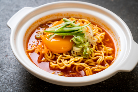 korean spicy instant noodles with egg, vegetable and kimchi - korean food styleの写真素材