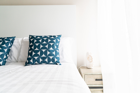 beautiful pillow on bed decoration in bed room interiorの写真素材