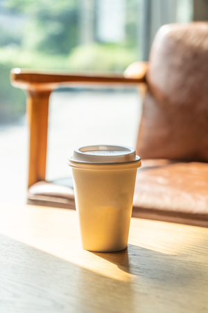 hot coffee paper cup in coffee shop and cafeの写真素材