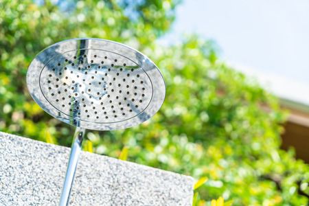 outdoor rain shower in swimming pool areaの写真素材