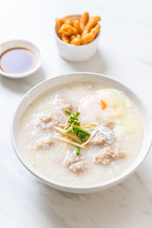 congee with minced pork in bowl - Asian breakfast styleの写真素材