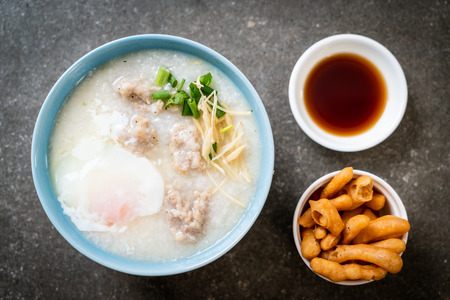 congee with minced pork in bowl - Asian breakfast styleの写真素材