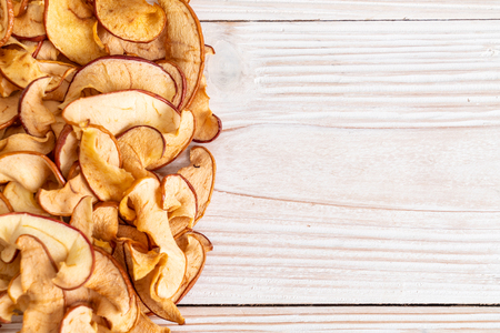 Homemade dried organic apple sliced on wood backgroundの写真素材