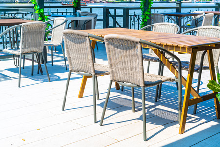 empty outdoor patio table and chair in restaurant and coffee shop