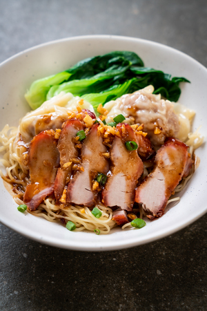 egg noodle with red roasted pork and wonton - Asian food styleの写真素材