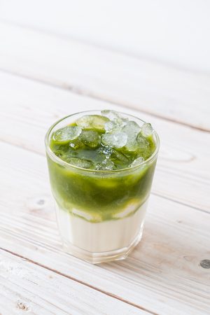 iced matcha green tea latte with milkの写真素材