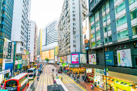 HONG KONG - FEB 21 2019: People walking across Hennessy Road, Causeway Bay with a big department store in Hong Kong.のeditorial素材