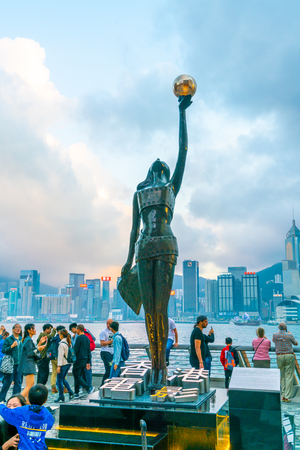 HONG KONG, CHINA - FEB 20 2019 : Statue and skyline in Avenue of Stars in Hong Kong, China. The promenade honours celebrities of the Hong Kong film industry as the famous attraction.のeditorial素材