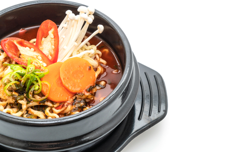 korean instant noodles in black bowl - korean food style isolated on white backgroundの写真素材