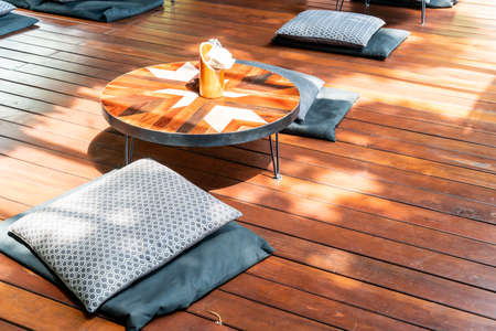 empty table and cushions in cafe restaurantの写真素材