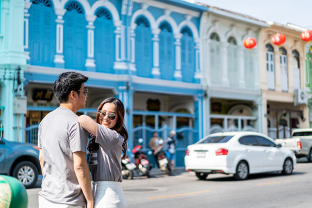 Happy young Asian couple in love having a good time in Phuket, Thailandの写真素材
