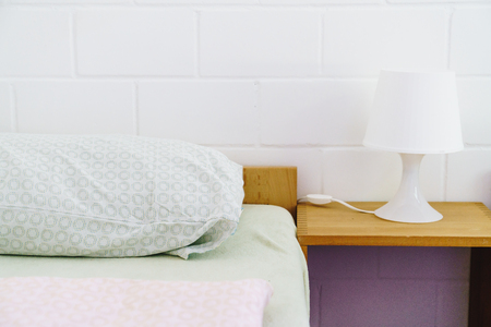 Comfortable pillow on bed decoration in bedroom interiorの写真素材