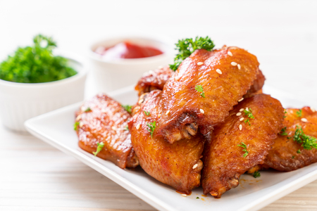 baked barbecue chicken wings with white sesameの写真素材