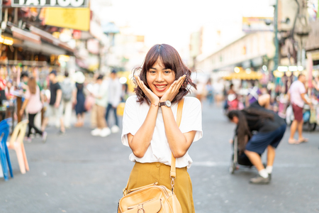 Happy and Beautiful Asian woman traveling at Khao Sarn Road in Thailandの写真素材