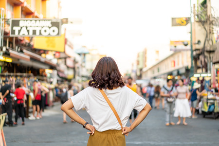 Happy and Beautiful Asian woman traveling at Khao Sarn Road in Thailandの写真素材