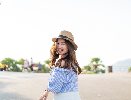 Happy young Asian woman in love having a good time in Parkの写真素材